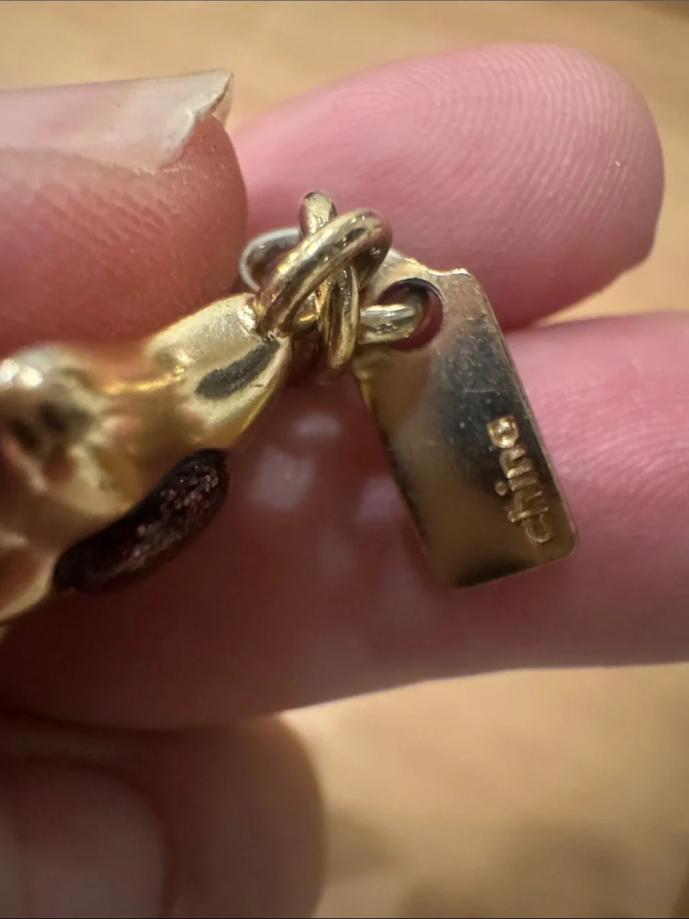 Coach Gold-Tone Shooting Star Key Charm with Purple Accents